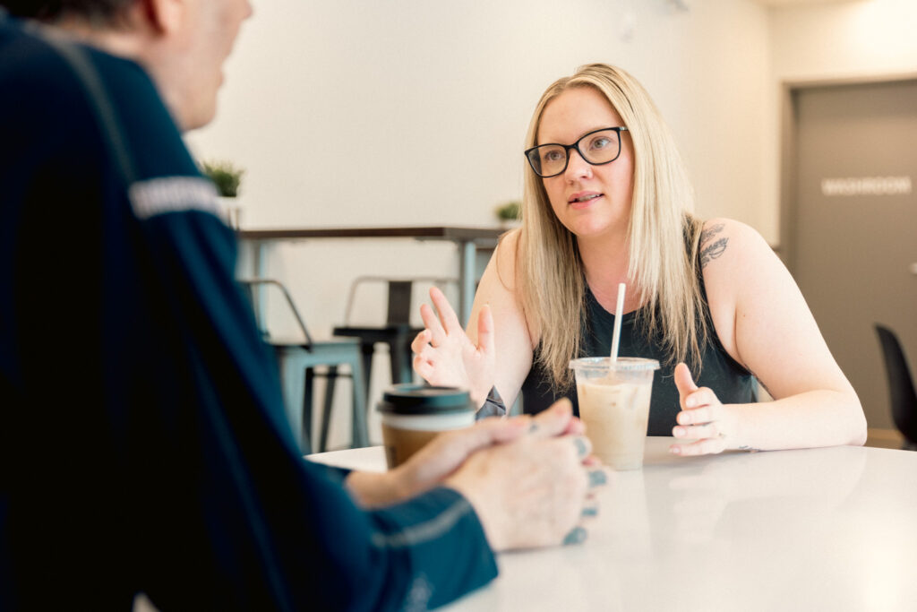 Member of staff converses with tenant